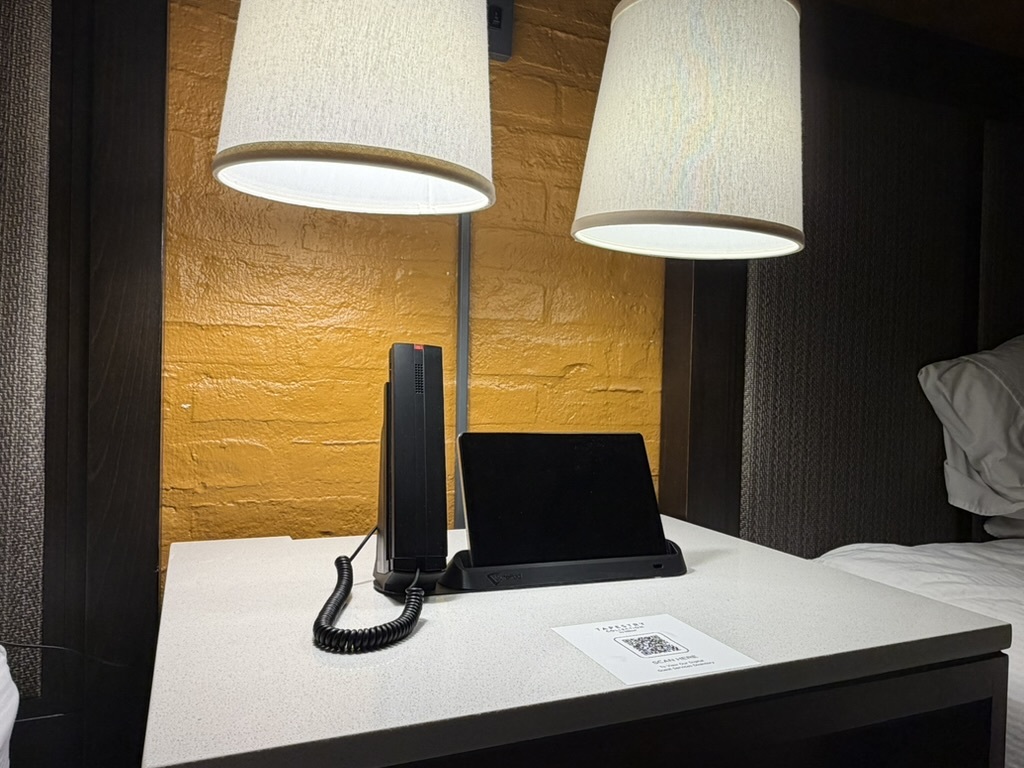 SuitePad Phone Dock on a hotel nightstand