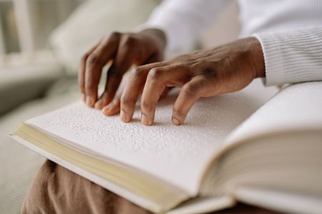 A person reading braille 
