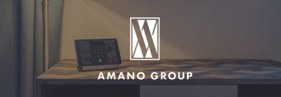 SuitePad In-Room Tablets inside an AMANO Group hotel room on a desk