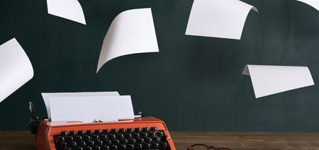 Typewriter with floating paper around