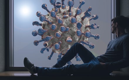 Man looking at giant coronavirus in window