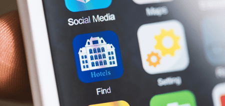 a tablet or a mobile device showing hotel app icon 