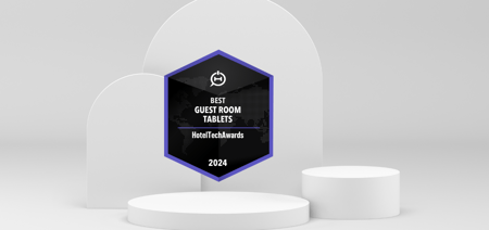SuitePad HotelTechAwards 2024 badge on a white platform. 