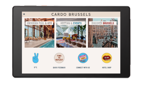 A SuitePad in-room tablet showing branded icons of a hotel customer