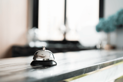 Empty reception desk with a service bell