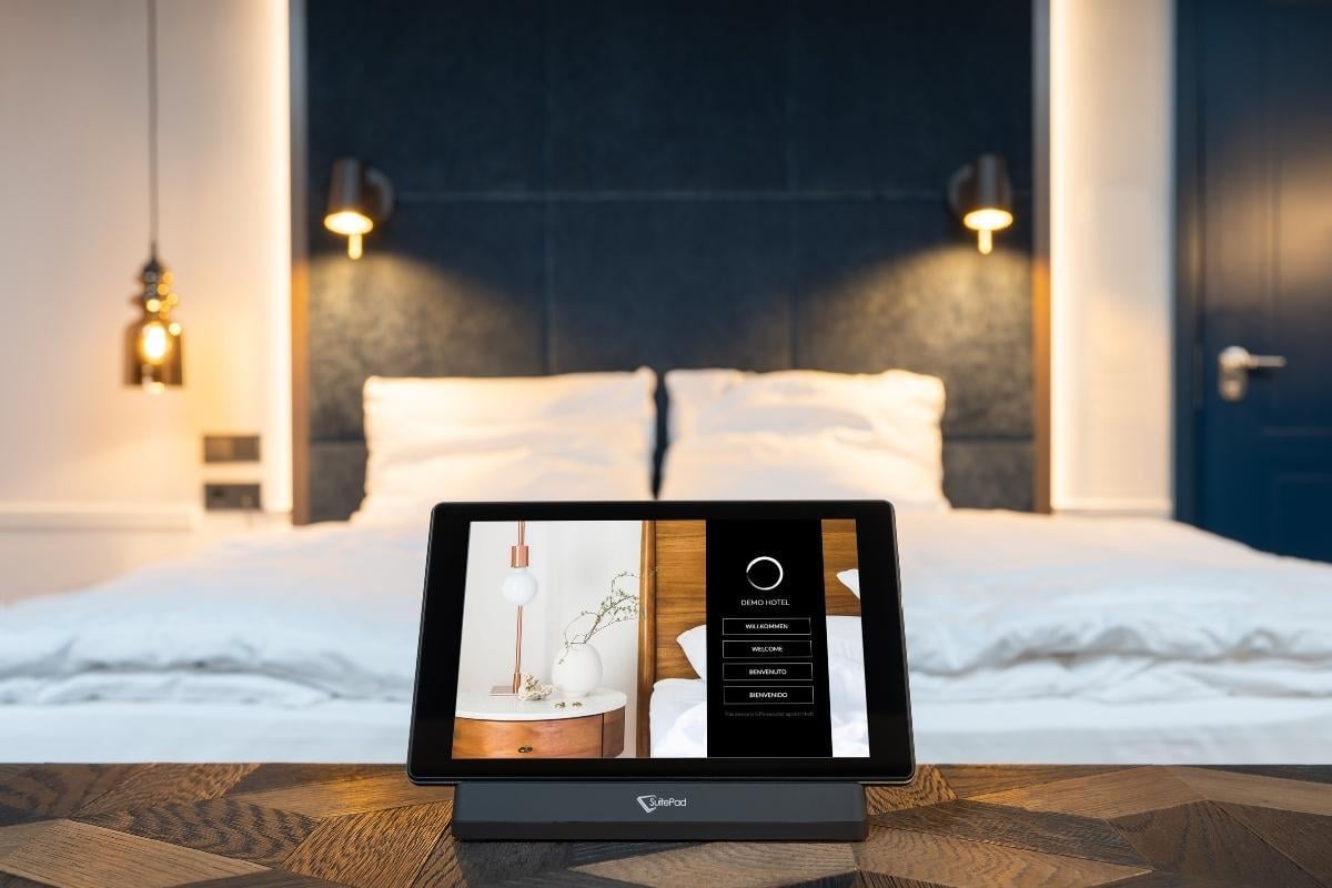SuitePad tablet in docking station on hotel nightstand
