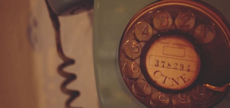 an old phone symbolizing old hotel phones and the history of hotel room tech