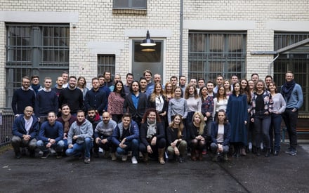 SuitePad employees posing for a photo outside of the SuitePad office