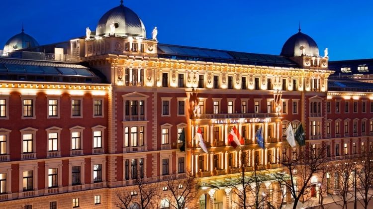 The front view of a Kempinksi hotel at night